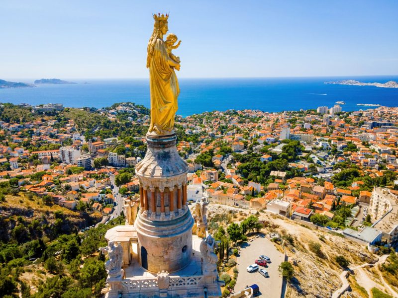 The,Aerial,View,Of,Basilique,Notre-dame-de-la-garde,In,Marseille,,A,Port